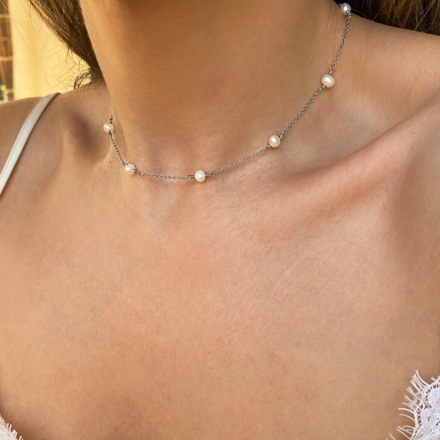 10 Freshwater Pearl Necklace for Woman with silver cable chain on model